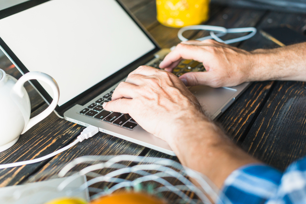 a guy using laptop